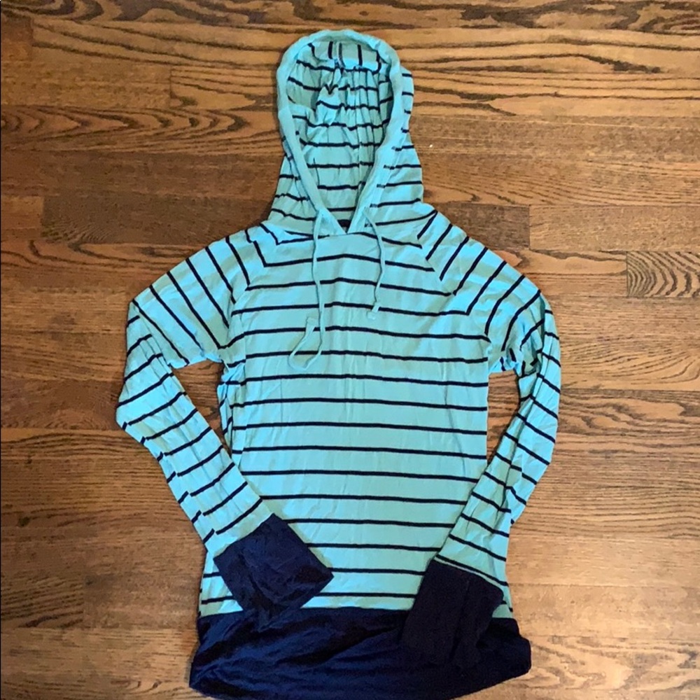 Medium, lightweight long sleeve hooded shirt.